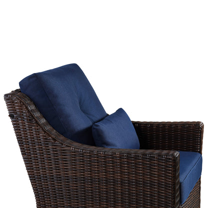 Elara rattan outdoor rocking swivel accent chair side view with navy cushions - CHITA Living