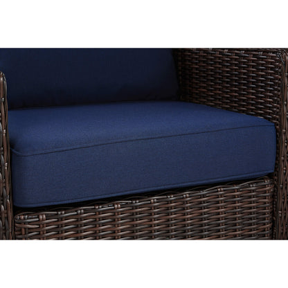 Close-up of Elara rattan chair with plush navy cushion and woven wicker detail - CHITA Living