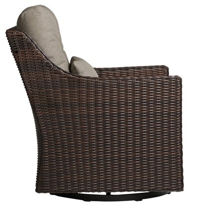 Side view of Elara rattan outdoor rocking swivel chair with taupe cushion, elegant design - CHITA Living