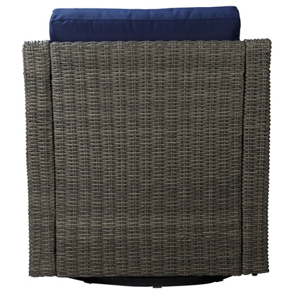 Back view of Elara rattan swivel chair with navy cushion, stylish outdoor design - CHITA Living