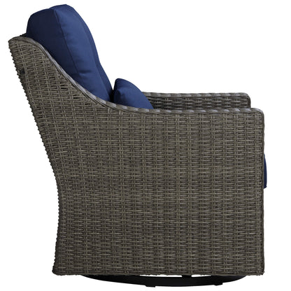 Side view of Elara rattan outdoor rocking swivel chair with navy cushions for outdoor elegance - CHITA Living