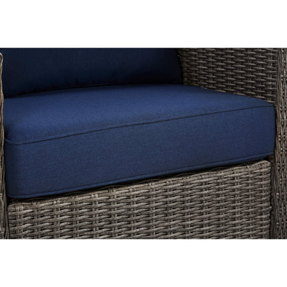 Close-up of Elara rattan rocking swivel chair with navy cushion, stylish outdoor comfort - CHITA Living