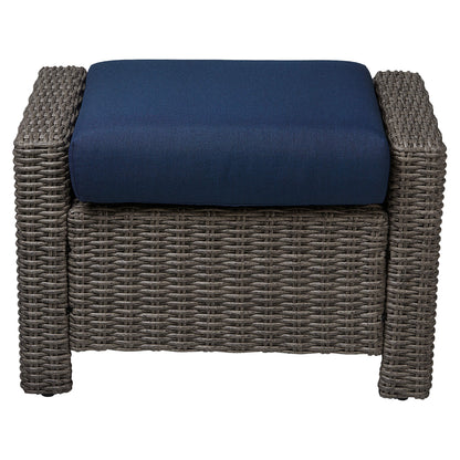 Elara rattan ottoman with navy cushion for stylish outdoor seating - CHITA Living