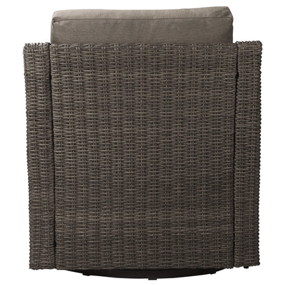 Gray rattan lounge chair back view with plush gray cushion in outdoor setting - CHITA Living