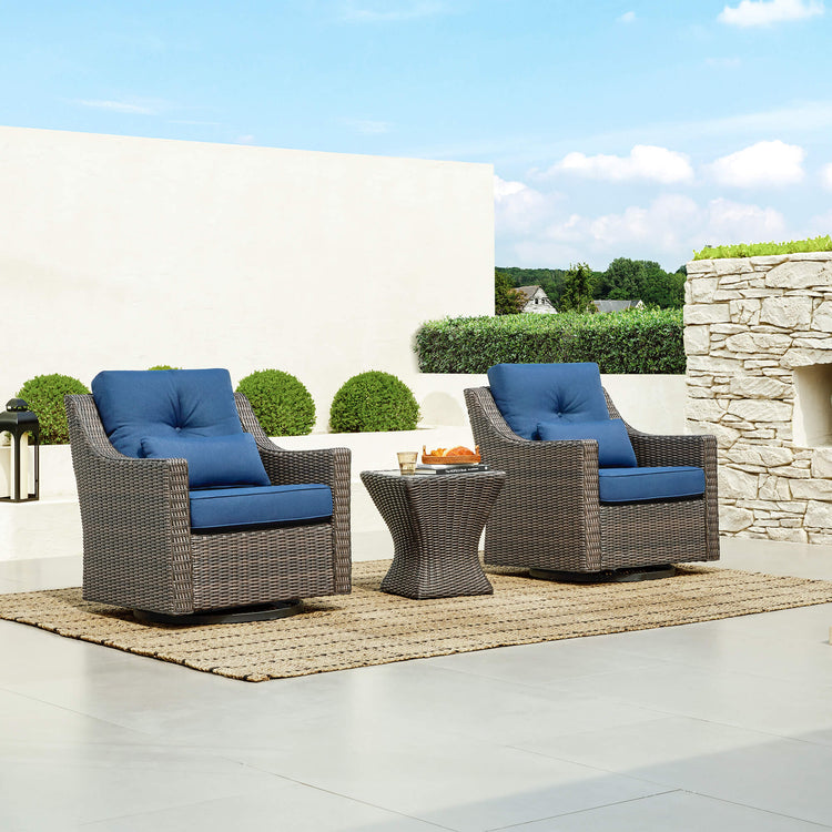 Elara Rattan Outdoor Bistro Set with blue cushions on a patio - CHITA Living