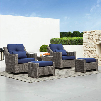 Elara Rattan Outdoor Side Table enhancing modern patio setting with blue-accented chairs - CHITA Living