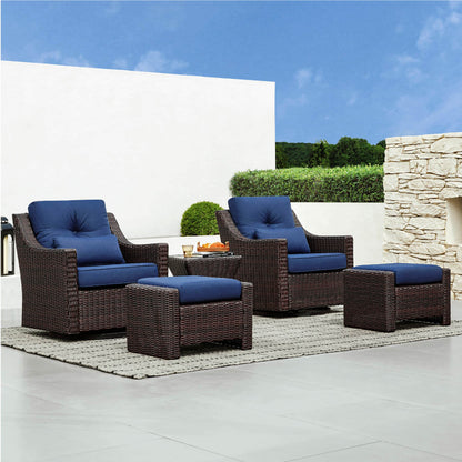 Elara Rattan Outdoor Side Table beside wicker chairs in modern outdoor patio setting - CHITA Living