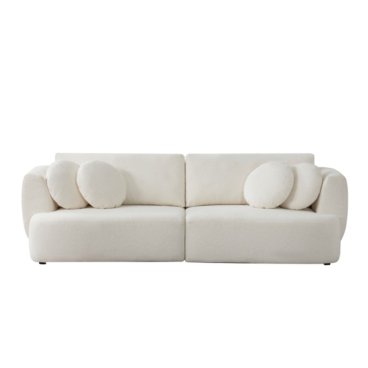 Grace 2-seat modular curved white sofa with round cushions in a bright room - CHITA Living
