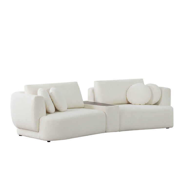 Grace modular white curved sofa with round cushions and wooden console in a bright living room - CHITA Living