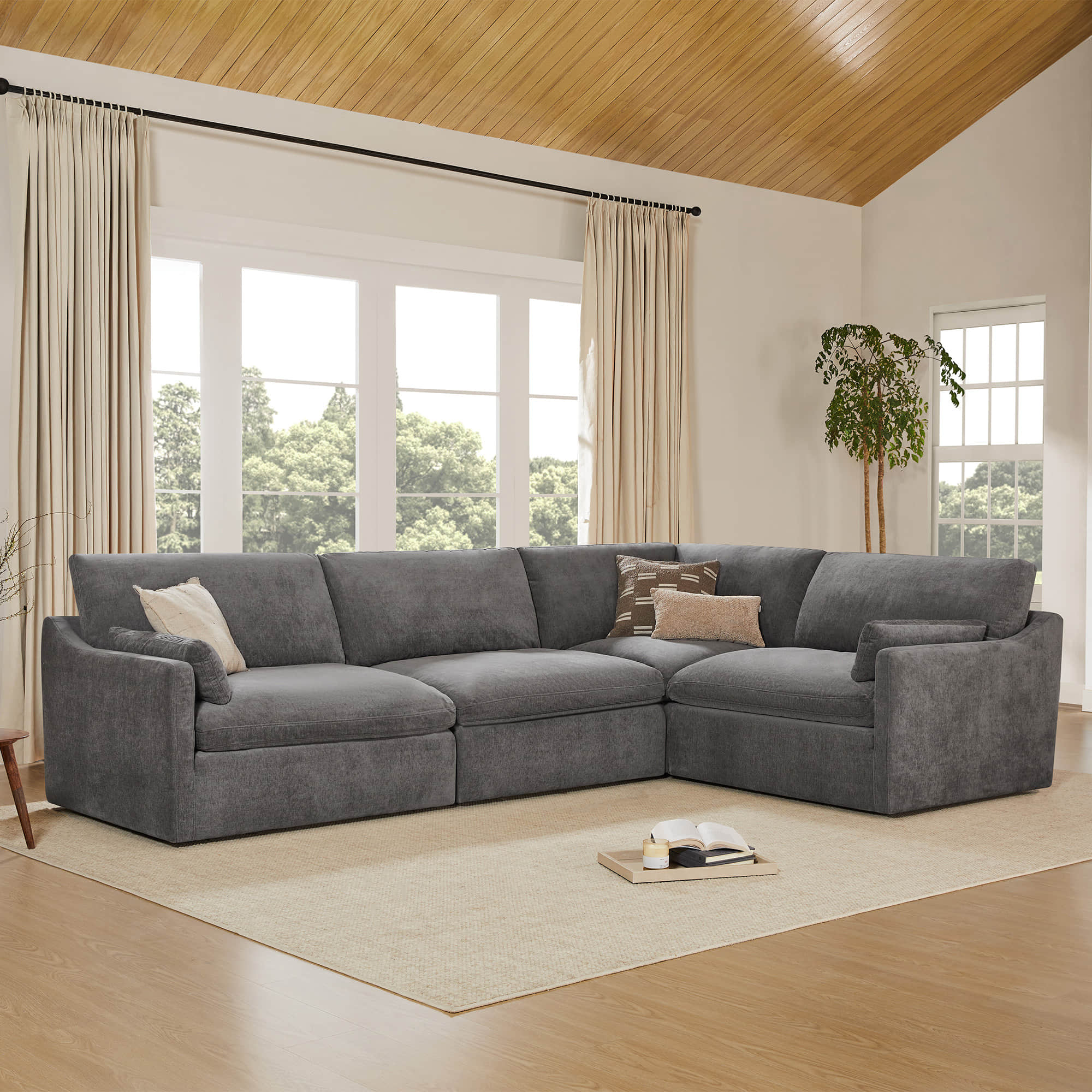 Gray Kenna Modular 4 Seat Sofa-Chaise Sectional in living room, modern design with soft cushions.