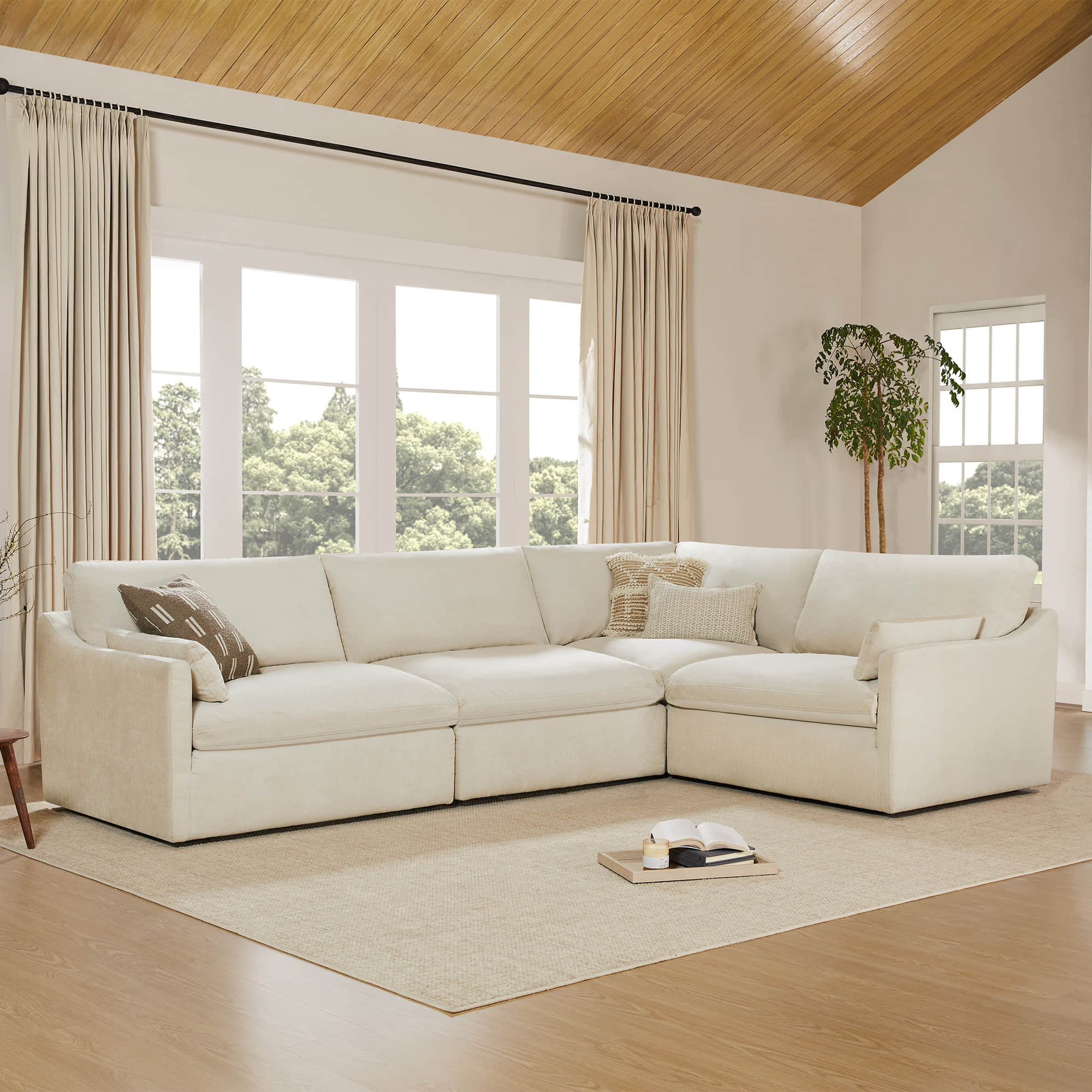 Cream Kenna Modular Sofa-Chaise Sectional in bright living room with soft cushions, comfortable seating
