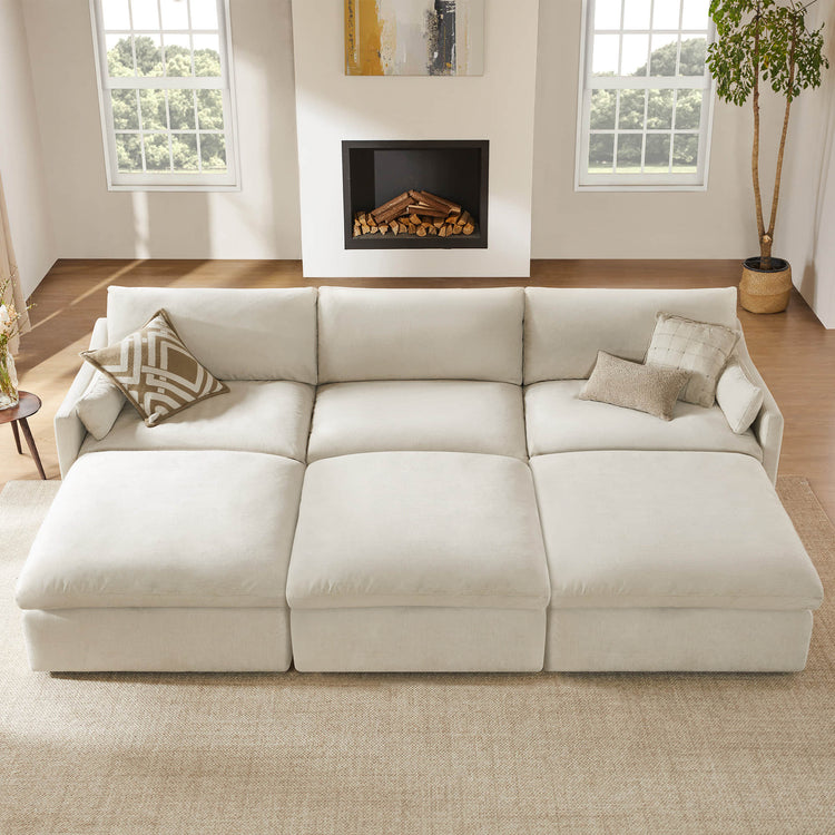 Kenna Modular 6 Seat Sofa Pit Sectional in Cream. Sectional Sofa with Pillows in Living Room