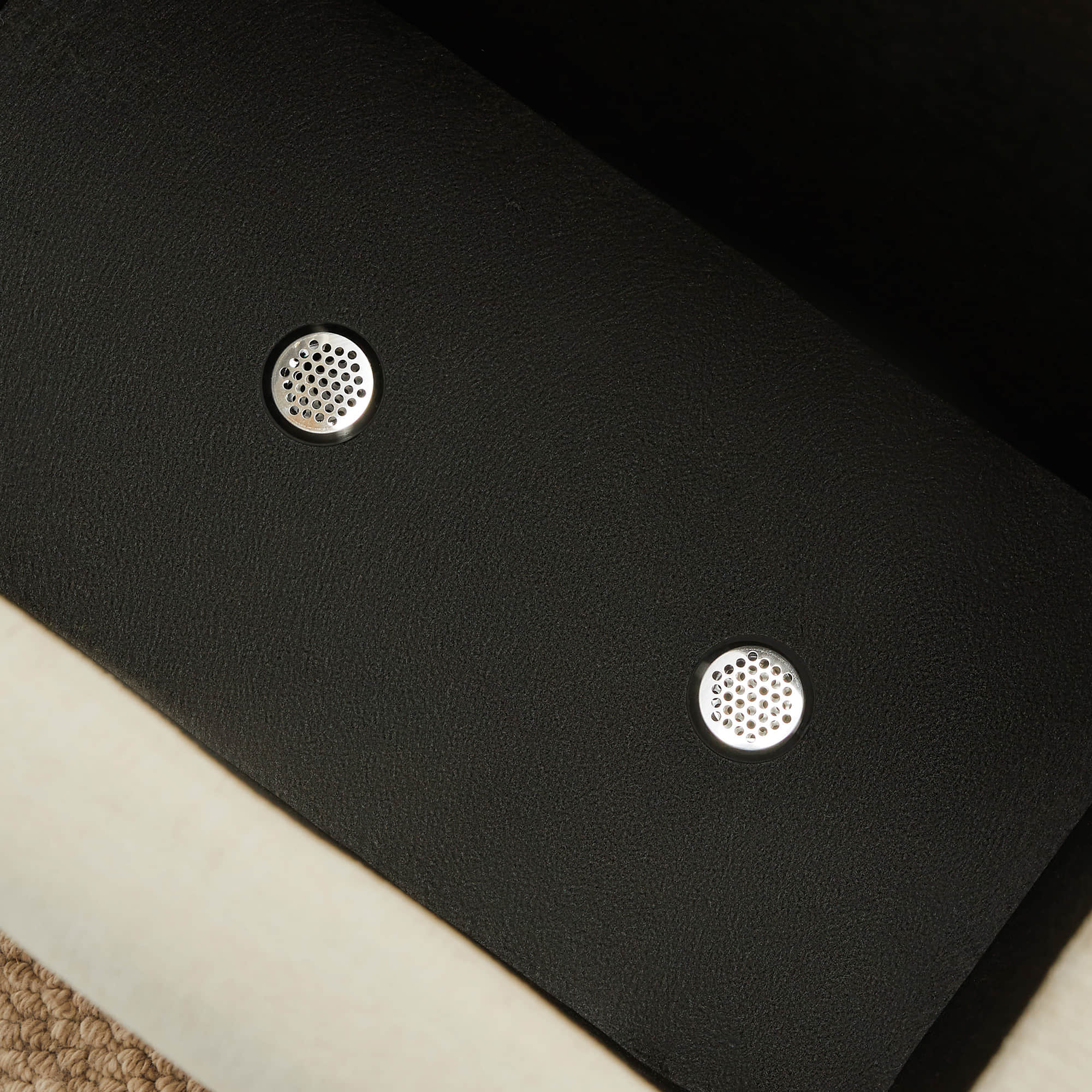 Kenna Modular Sofa-Chaise sectional detail, textured black fabric and ventilation, comfortable seating