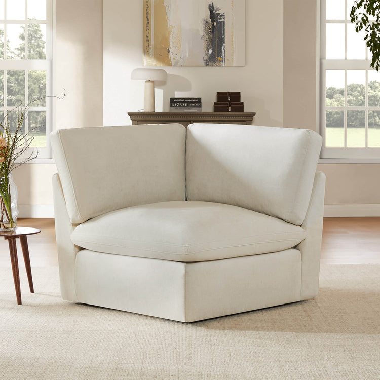 Kenna Modular Corner Seat in cream fabric, perfect for comfortable lounging. Soft, deep seating for living room.