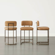 Set of three comfortable leather bar stools ideal for family dining at the kitchen counter.