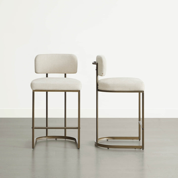 Two cream kitchen barstools, counter & bar height options shown.