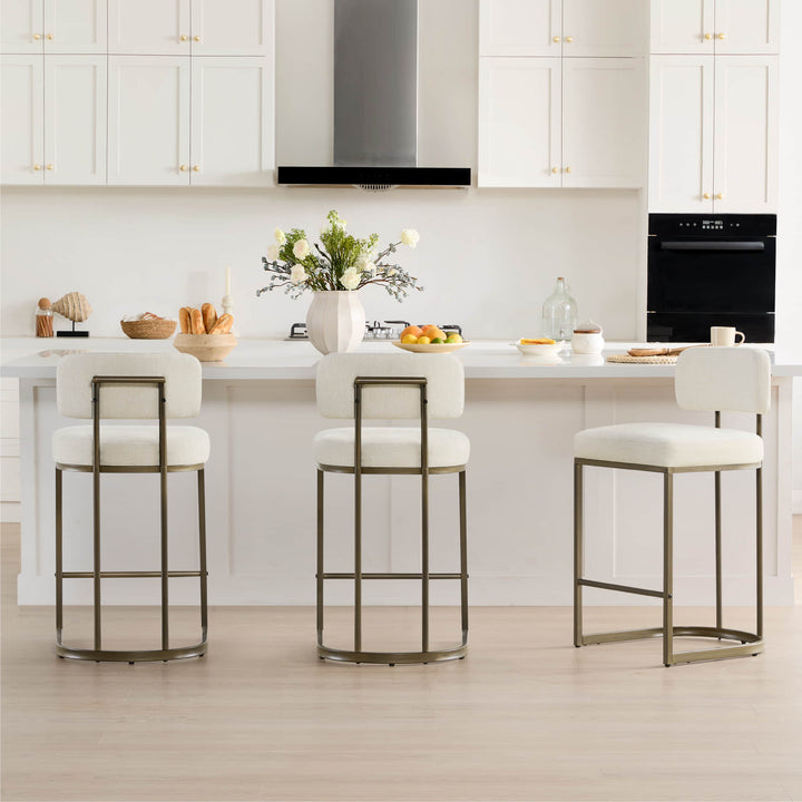 Bright and inviting kitchen space featuring leather bar stools, creating a perfect spot for casual meals and gatherings.