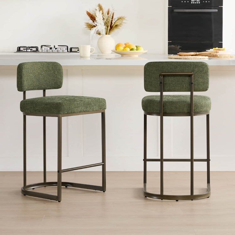 Two green kitchen barstools, dark metal frames, angled front view.