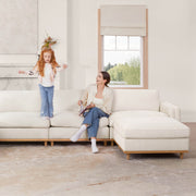 Woman and girl enjoying time on Liam 4-piece sectional sofa in bright living room - CHITA Living