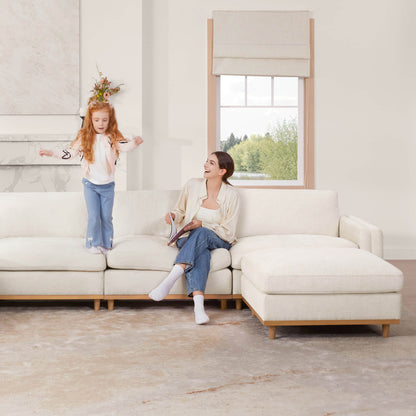 Woman and girl enjoying time on Liam 4-piece sectional sofa in bright living room - CHITA Living