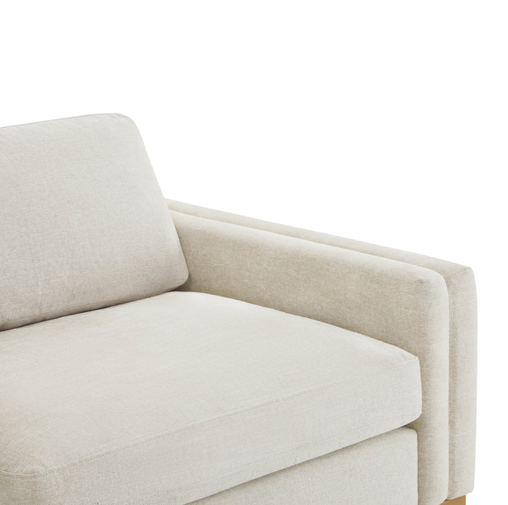 Close-up of plush cushion on Liam modular sectional sofa in light fabric - CHITA Living