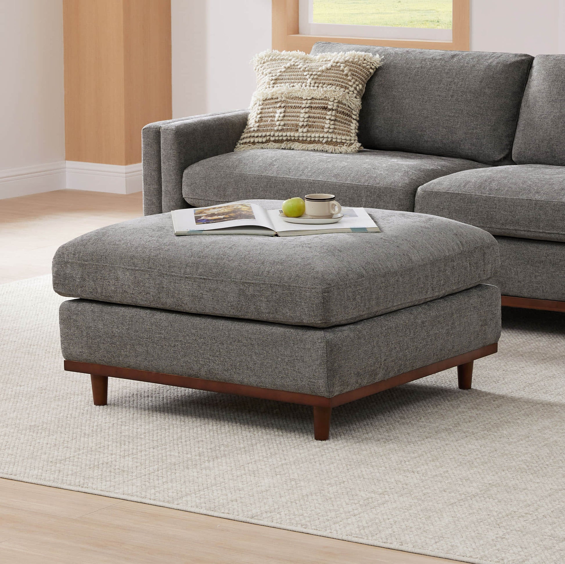 Liam modular ottoman in soft gray fabric with wooden legs in modern living room - CHITA Living