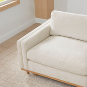 Liam modular sectional sofa corner view showcasing light fabric and wooden base - CHITA Living
