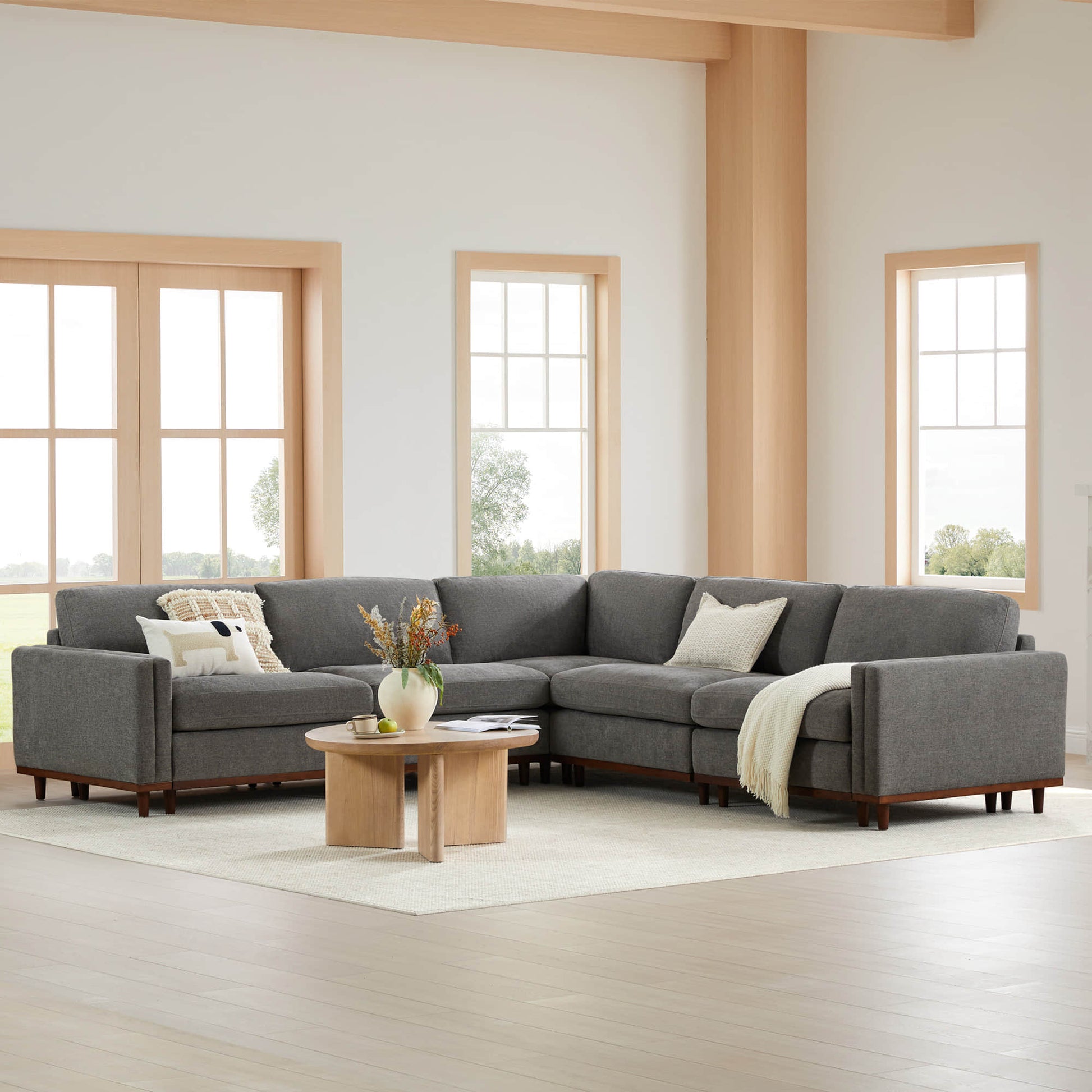 Liam 5-Piece Overstuffed Sectional in gray fabric, modern living room with large windows - CHITA Living