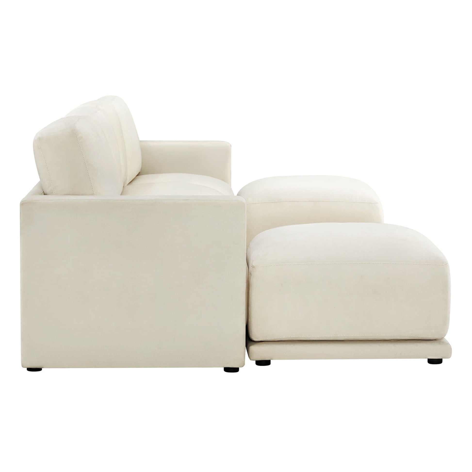 Side view of a modern white sectional sofa with a chaise lounge on one end.