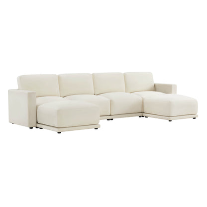 Angled view of a modern white sectional sofa with chaise lounges on both ends.