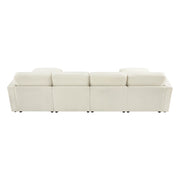 Rear view of a modern white sectional sofa, showing four back cushions aligned in a row.