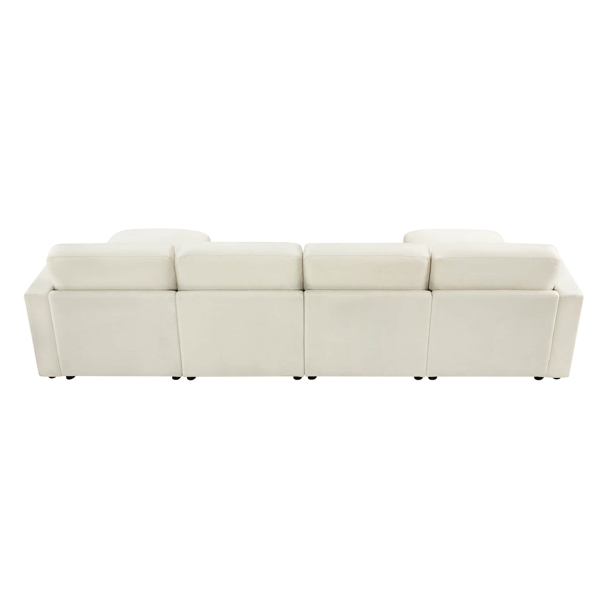 Rear view of a modern white sectional sofa, showing four back cushions aligned in a row.