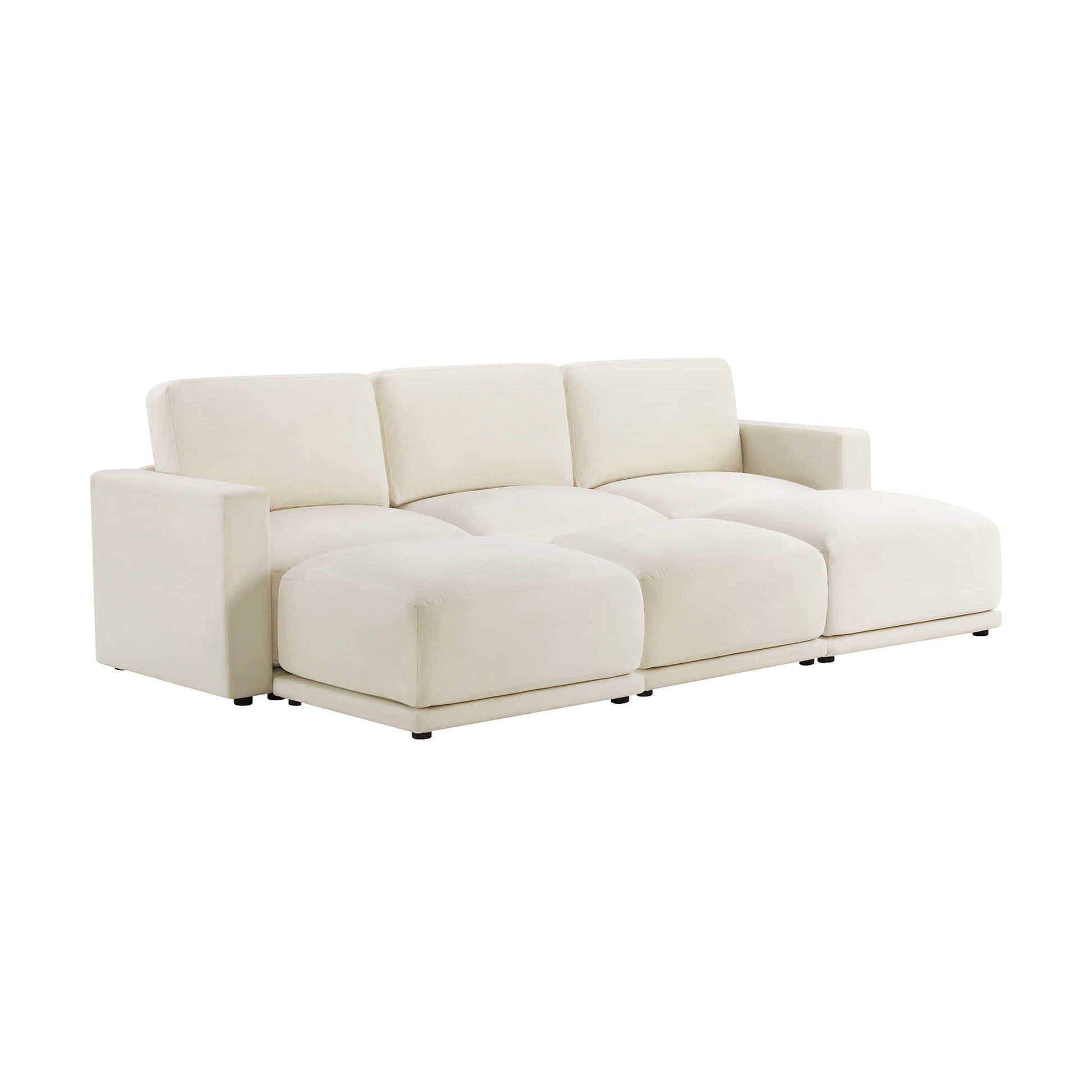 Angled view of a modern white sectional sofa with three seats and low armrests, showcasing its plush cushions and minimalist design.