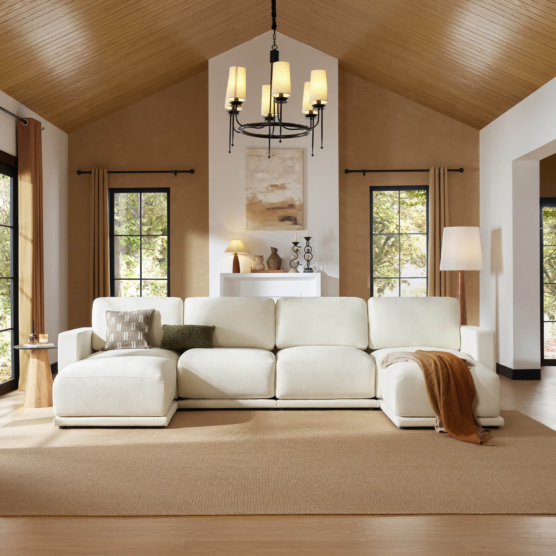 Spacious living room featuring a plush sectional sofa with chaise, complemented by warm tones and elegant decor.