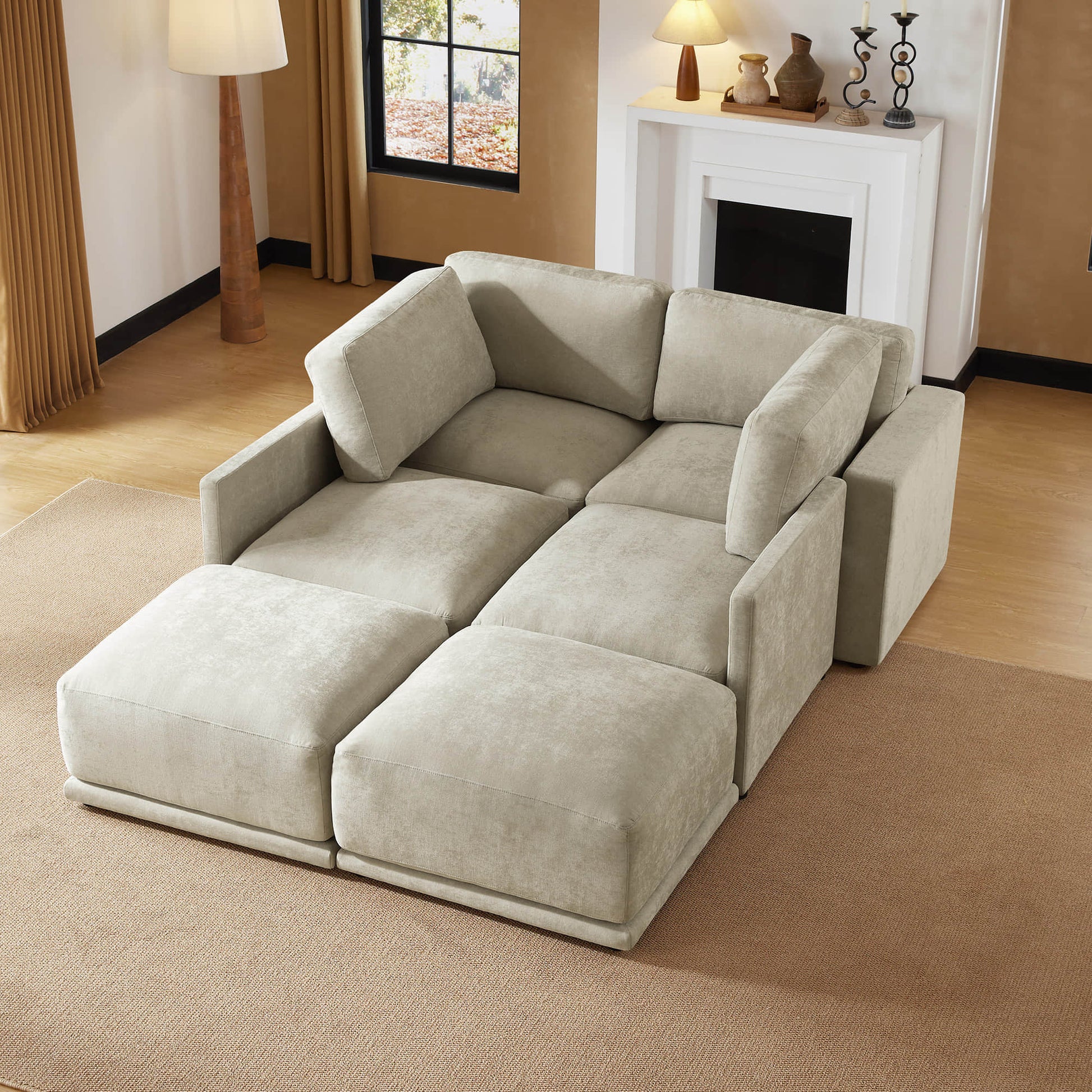  Modern modular sofa sectional arranged as a bed with plush fabric and cozy setup.
