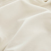 Close-up of fabric texture on modular sofa sectional.