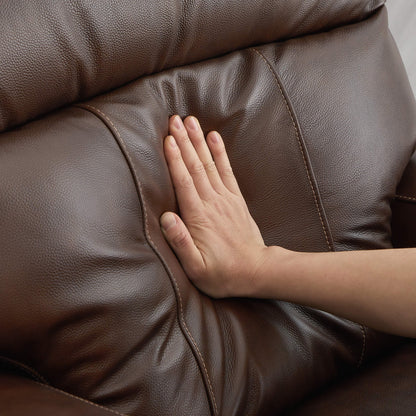 Close-up of hand pressing the plush cushion of Noah zero-gravity leather recliner - CHITA Living