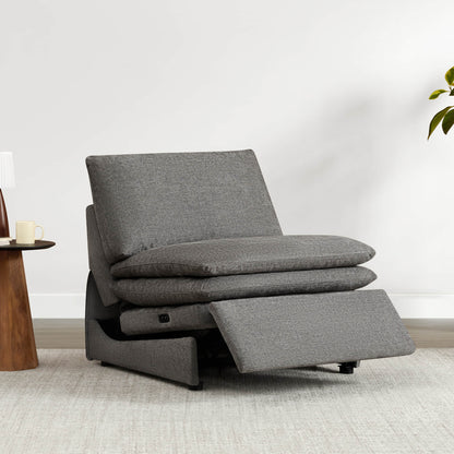 Gray armless recliner chair in upright position with plush cushions and footrest extended.