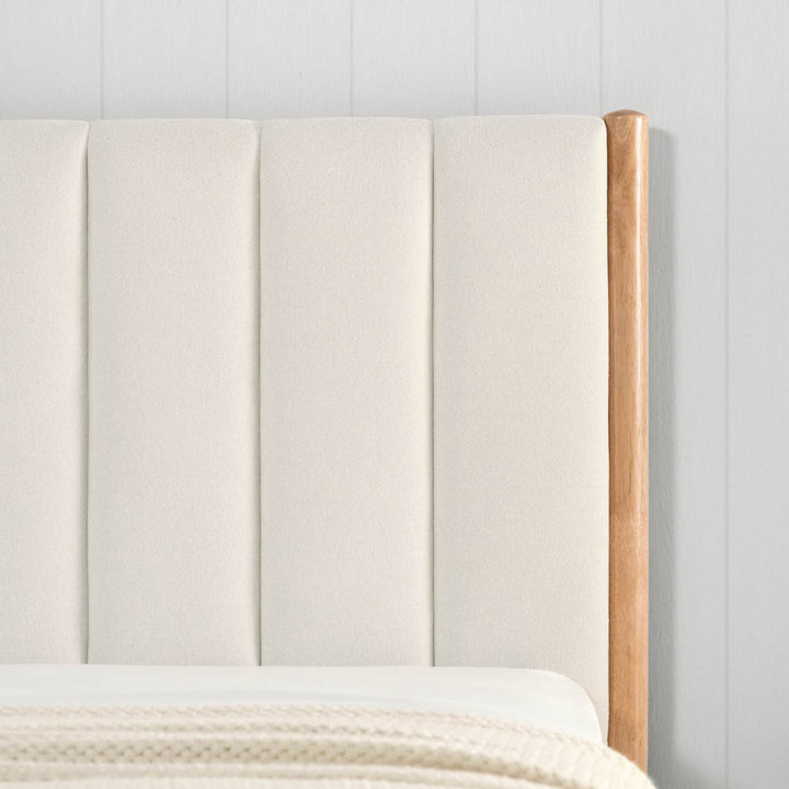 Close-up of cream fabric headboard with wooden frame on Serene platform bed - CHITA Living