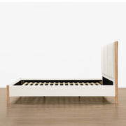 Serene contemporary platform bed side view showcasing slats and wooden frame - CHITA Living