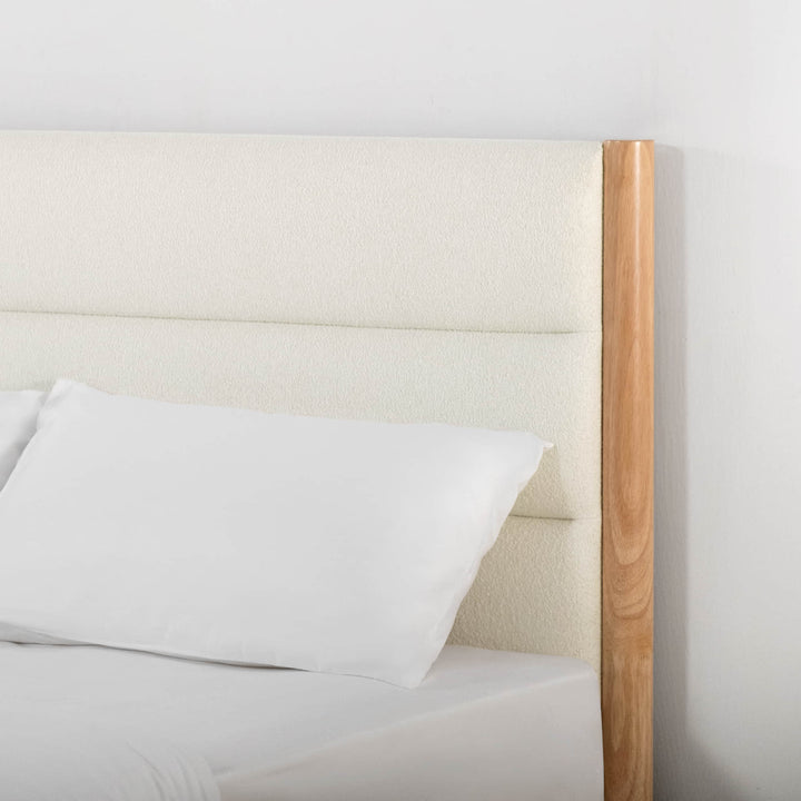 Boucle upholstered headboard with light fabric and solid wood details for modern bedroom style - CHITA Living
