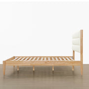 Side view of Solace Full Bed with boucle headboard and natural wood slats - CHITA Living