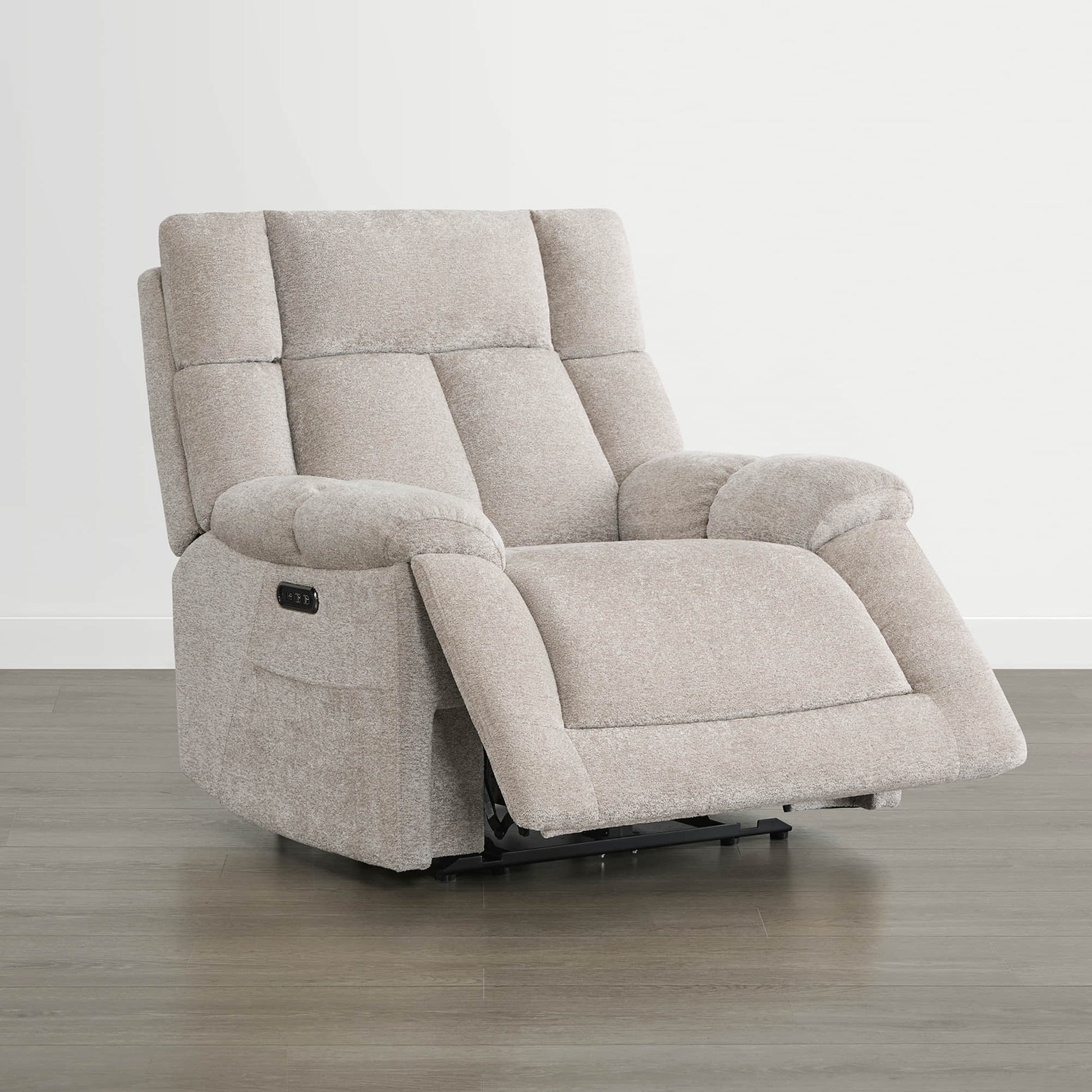 The Sonia Recliner, in beige fabric, offers Bluetooth speakers and power lumbar support for ultimate comfort.
