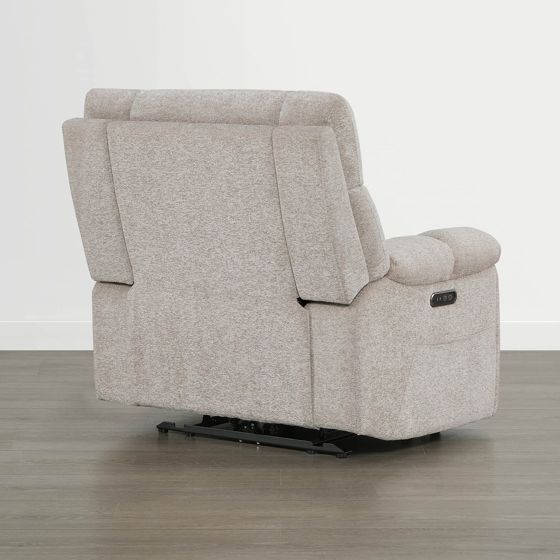 The Sonia Recliner, in beige fabric, features Bluetooth speakers and power lumbar support for ultimate comfort.
