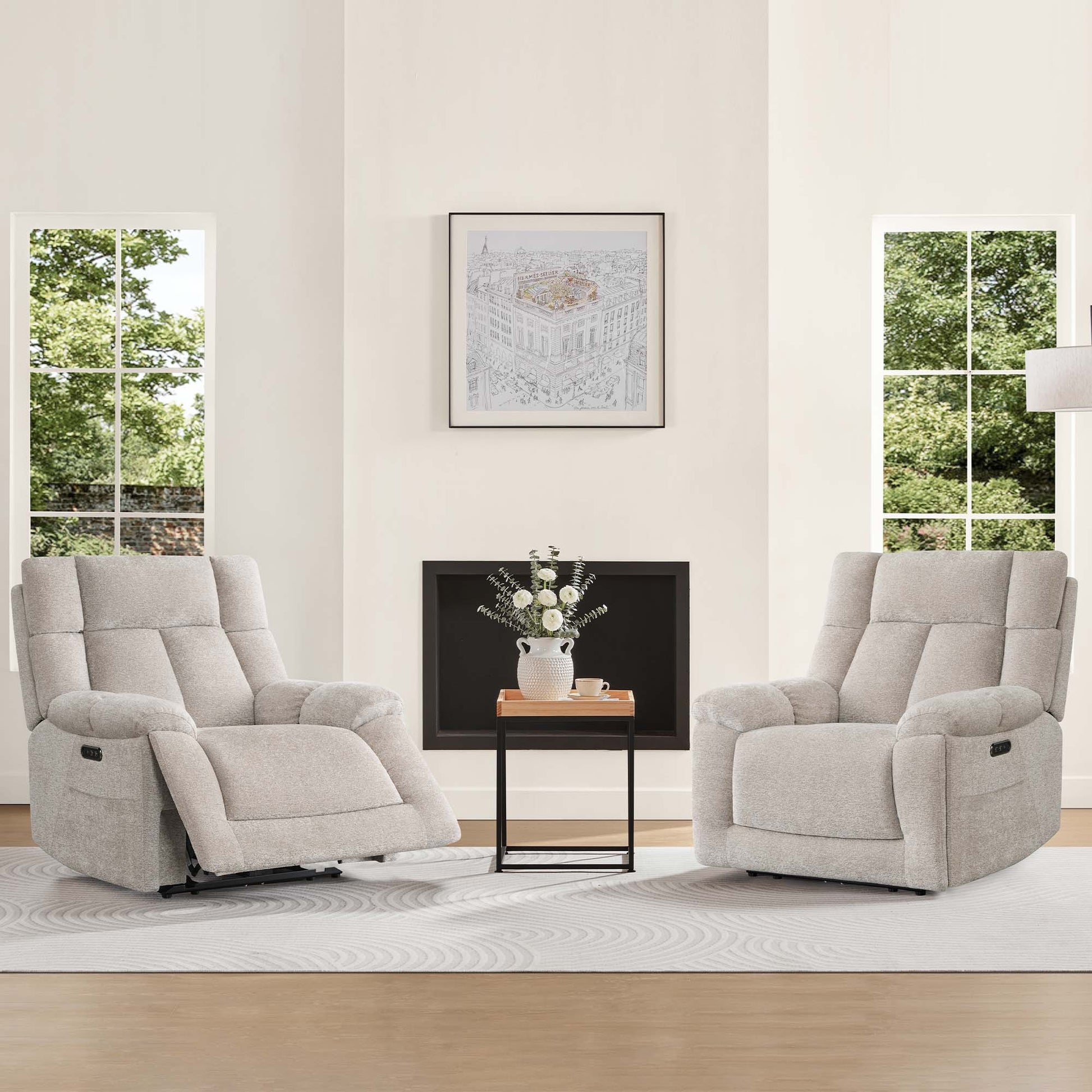 Two Sonia Recliners with Bluetooth speakers and power lumbar support, in light gray fabric, sit beside a TV on a cozy rug.