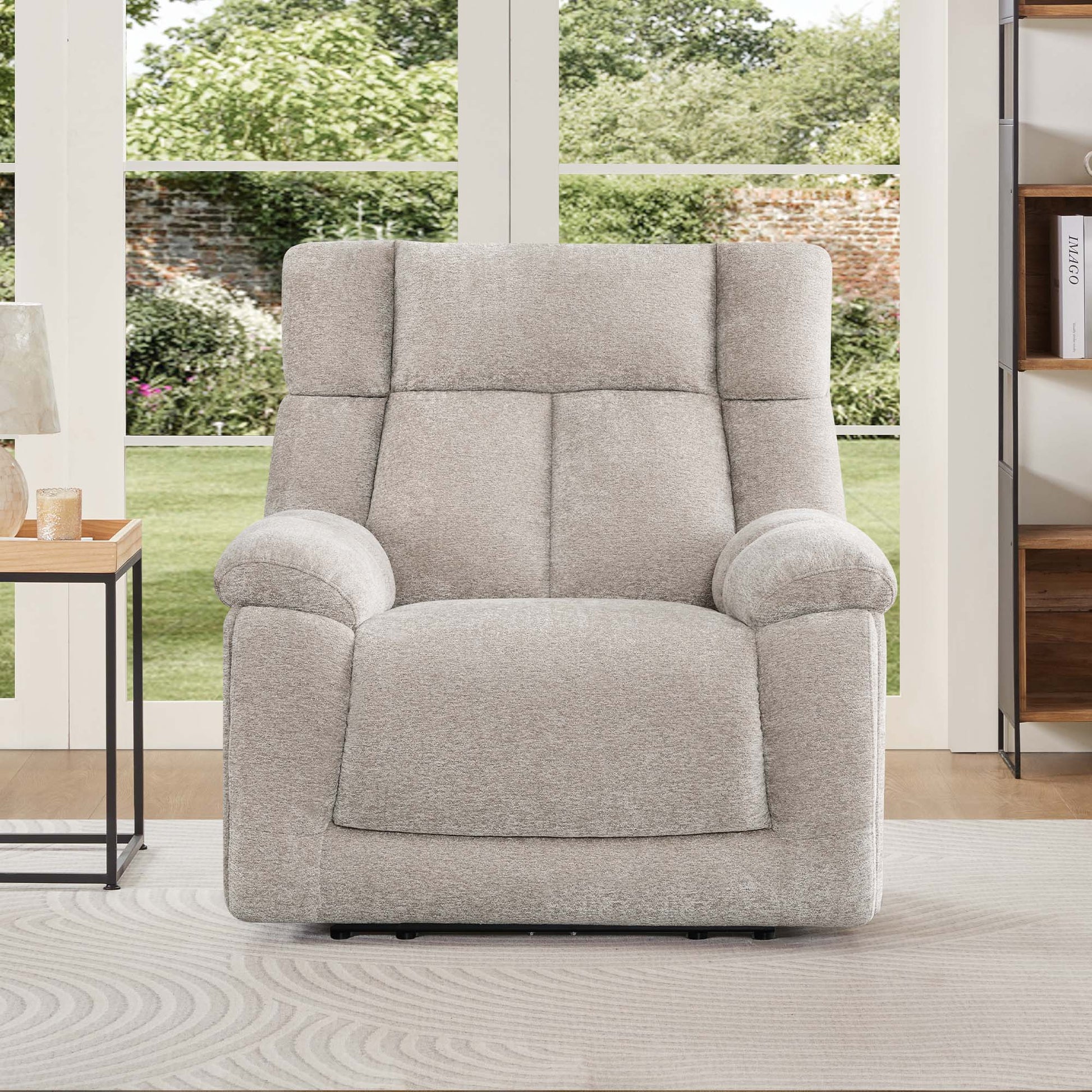 The Sonia Recliner, in cozy gray fabric, offers Bluetooth speakers and power lumbar support for ultimate relaxation.