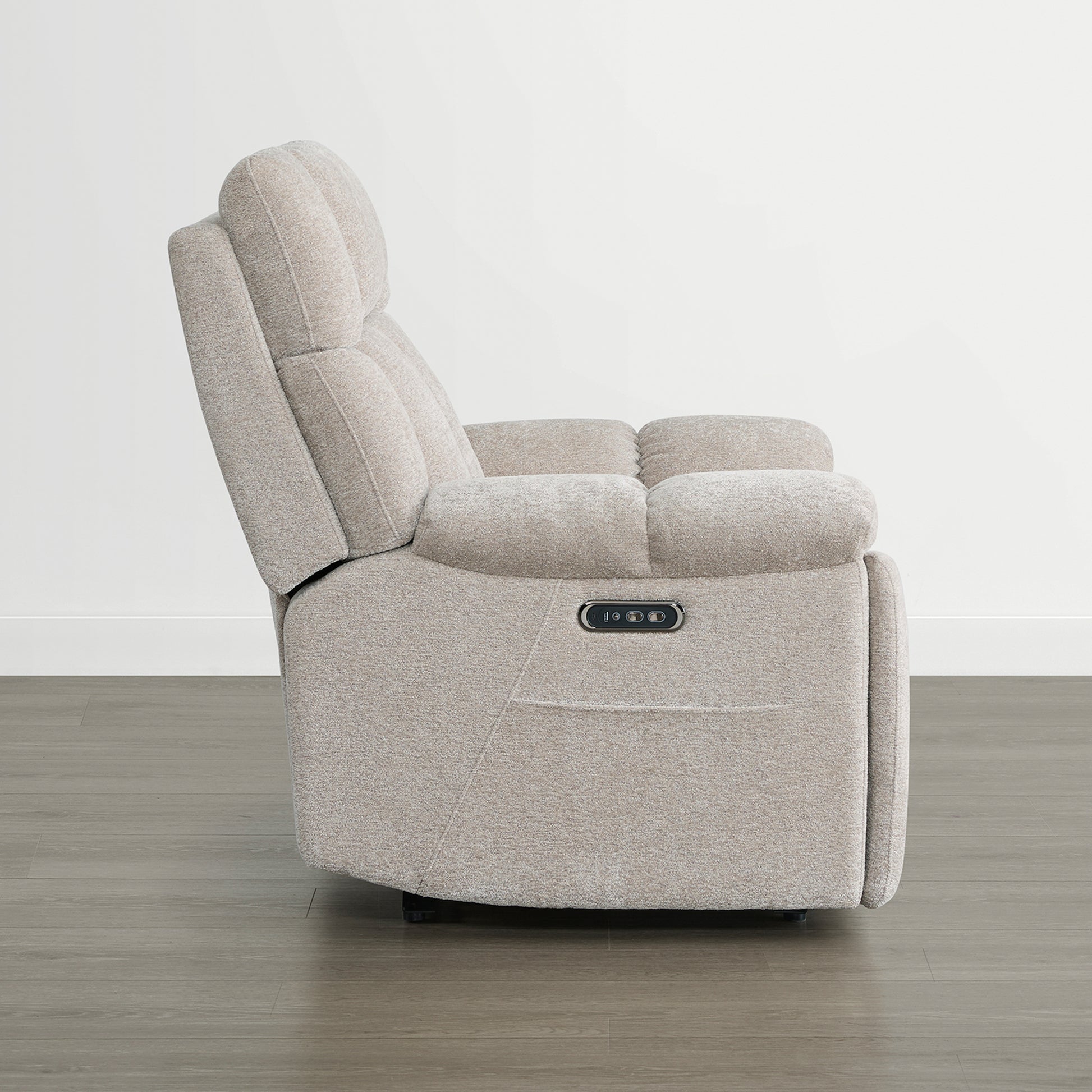 The Sonia Recliner, in beige fabric, features Bluetooth speakers and power lumbar support for ultimate comfort.