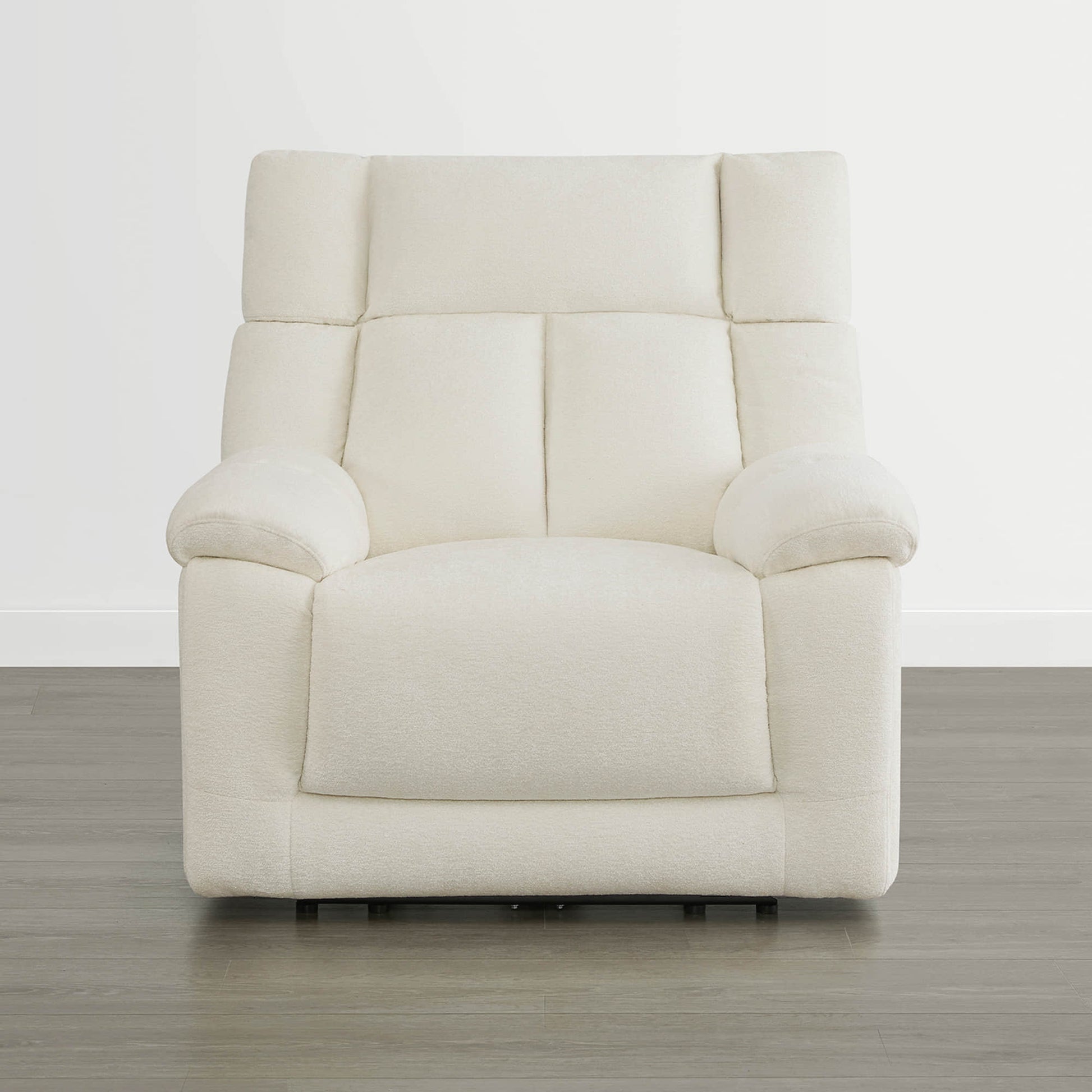 The Sonia Recliner, in cream fabric, features Bluetooth speakers and power lumbar support for ultimate comfort.