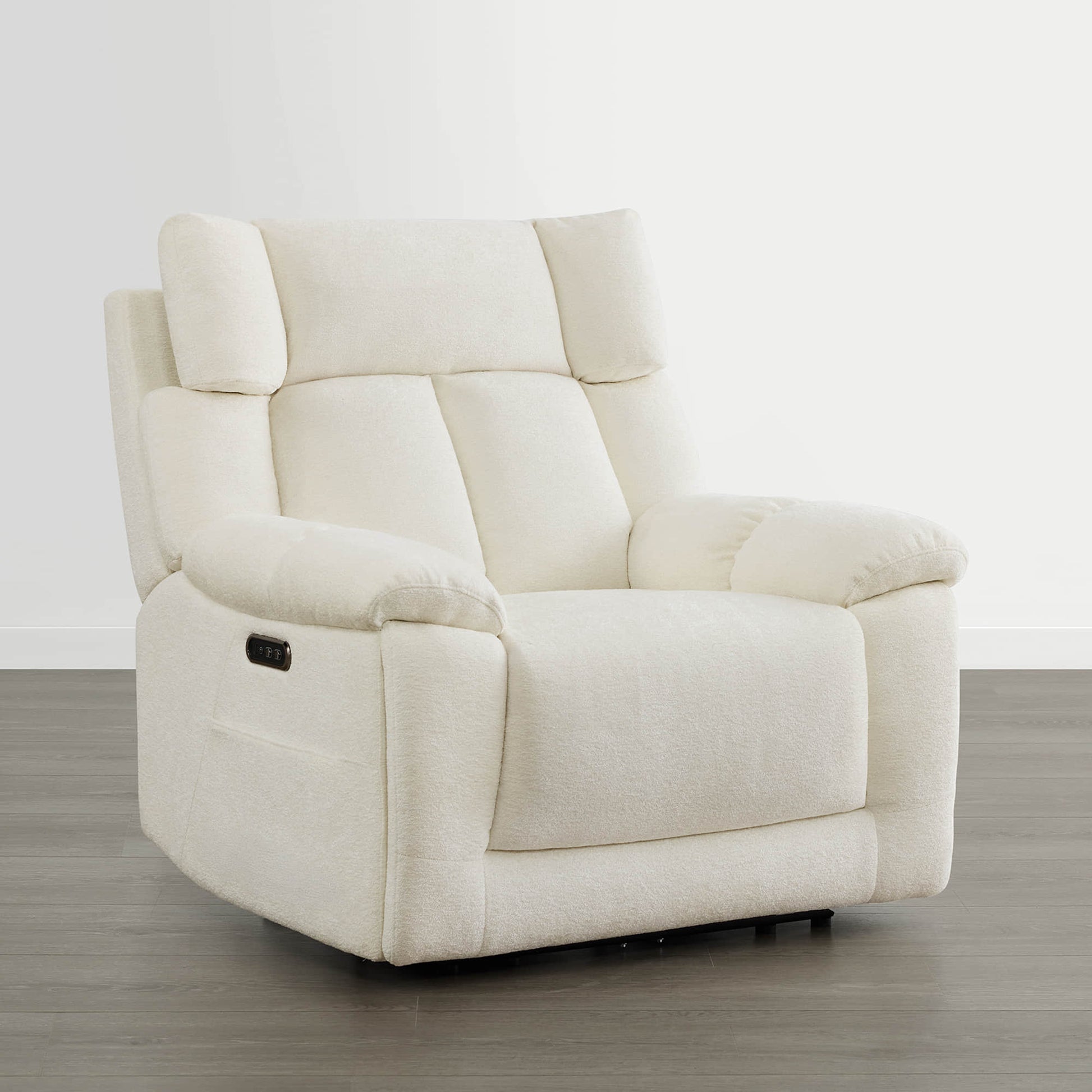 The Sonia Recliner, in cream fabric, features Bluetooth speakers and power lumbar support for ultimate comfort.