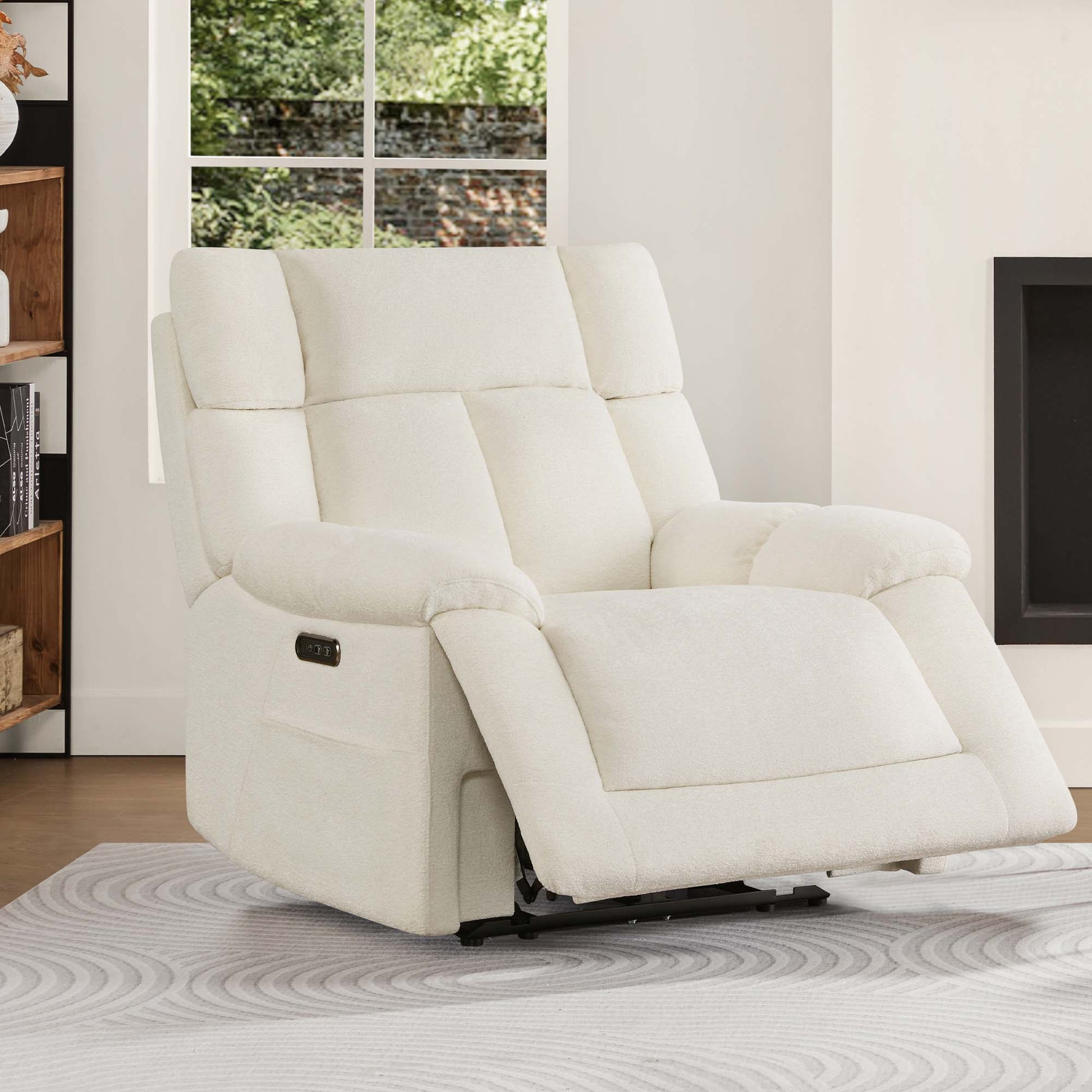 The Sonia Recliner, in soft white fabric, offers Bluetooth speakers and power lumbar support for ultimate relaxation.
